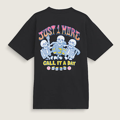 Black t-shirt with colorful skeleton design and text on a beige background