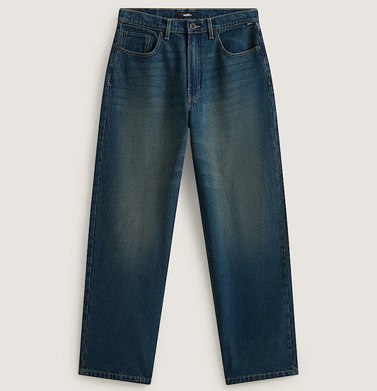 A pair of dark blue denim jeans with a subtle vertical fade wash, laid flat against a light beige background.
