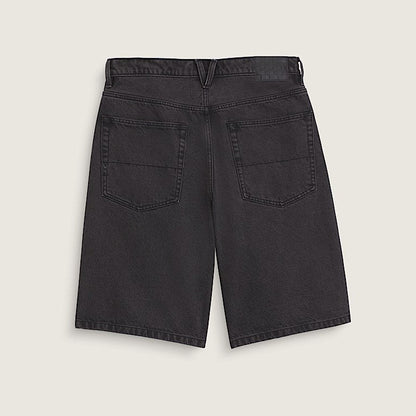 Black denim shorts on a light beige background