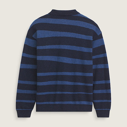 Navy and blue striped sweater on a light beige background