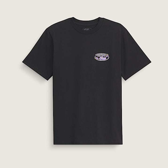 Black t-shirt with a small logo on a beige background