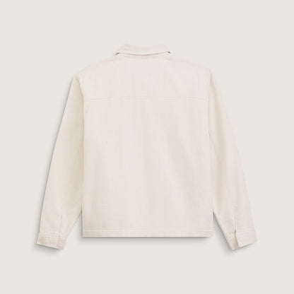 A light cream-colored long-sleeve utility jacket shown from the back, laid flat against a solid, light beige background.