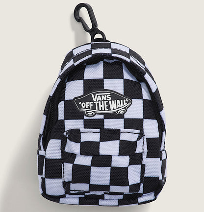 A small Vans 'Off The Wall' checkered backpack keychain or mini bag featuring a black and white checkerboard pattern, a black carabiner clip, and the brand's logo patch on the front, set against a light beige background.