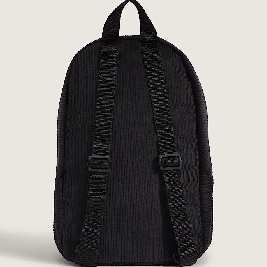 Black backpack on a light beige background