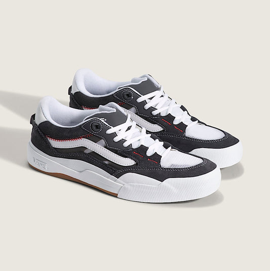 Pair of black and white sneakers on a light gray background