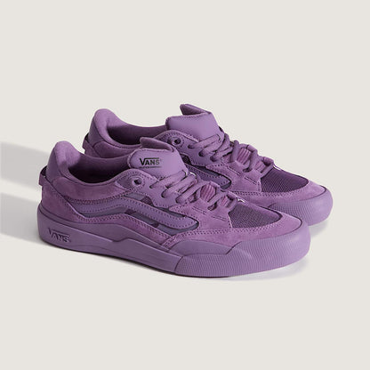 Purple sneakers with Vans logo on a light gray background