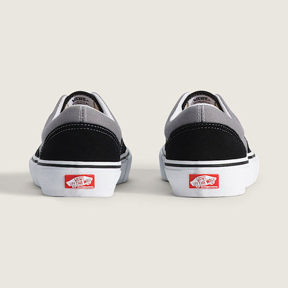Pair of Vans sneakers shown from the back on a light gray background