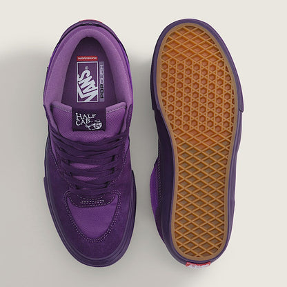 Two purple Vans Half-Cake sneakers shown from a top-down view on a light gray background, with one shoe displaying the purple suede and leather upper and the other showing the brown waffle-patterned outsole.