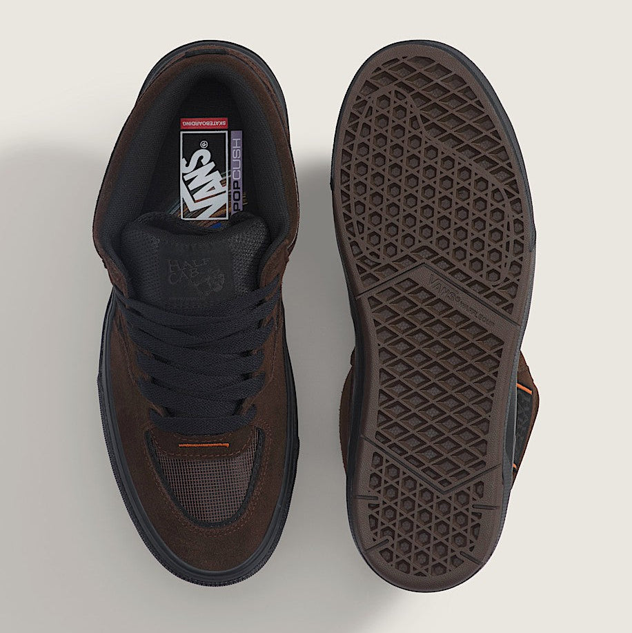 Brown sneaker with sole showing on a light gray background