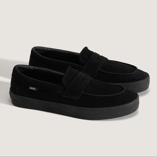 Pair of black loafers on a light gray background