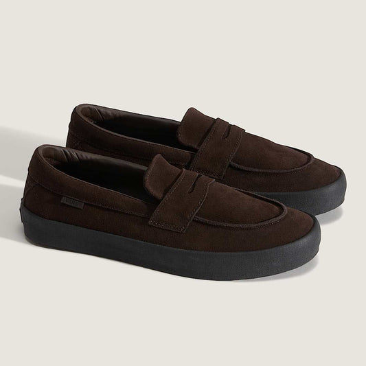 Pair of brown loafers on a light gray background