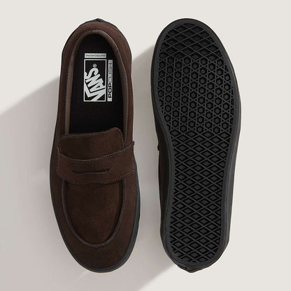 Brown loafer shoe with black sole on a light gray background