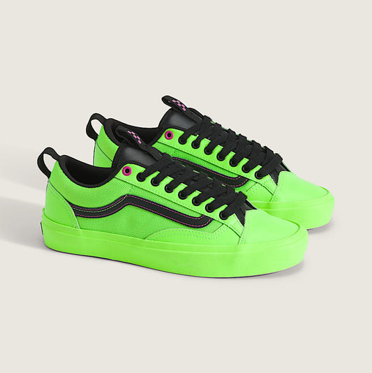 Neon green and black sneakers on a light gray background