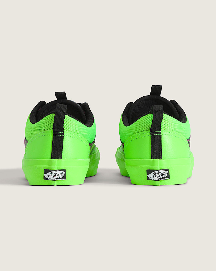 Neon green sneakers with black accents on a light gray background