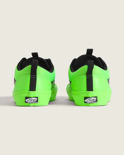 Neon green sneakers with black accents on a light gray background
