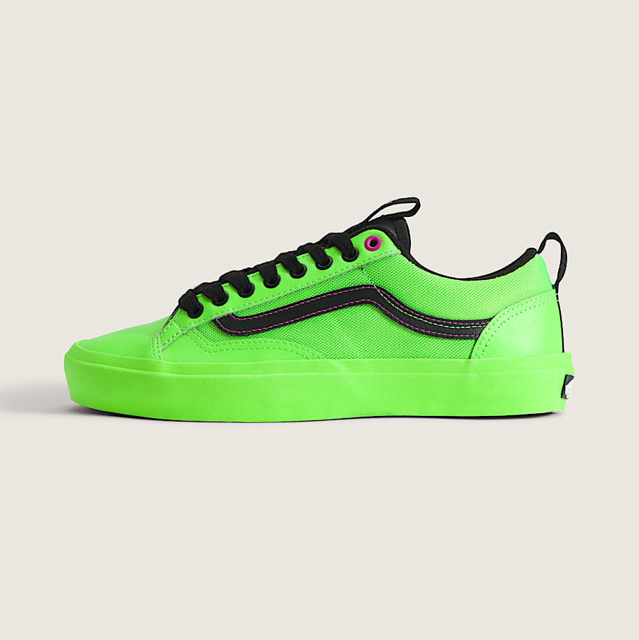 Neon green sneaker with black accents on a light gray background