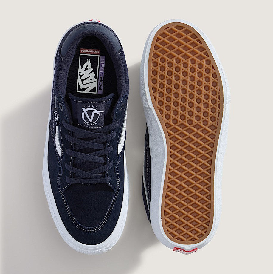 Navy blue sneaker with white sole on a light gray background