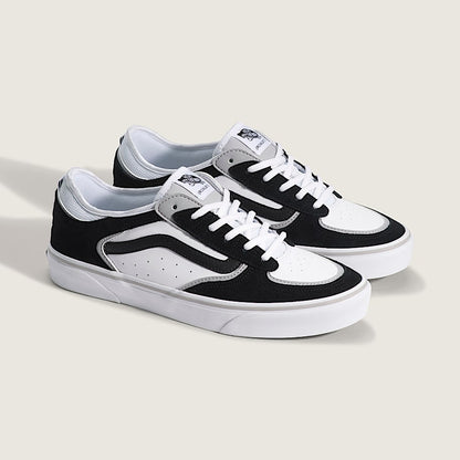 Black and white sneakers on a light gray background