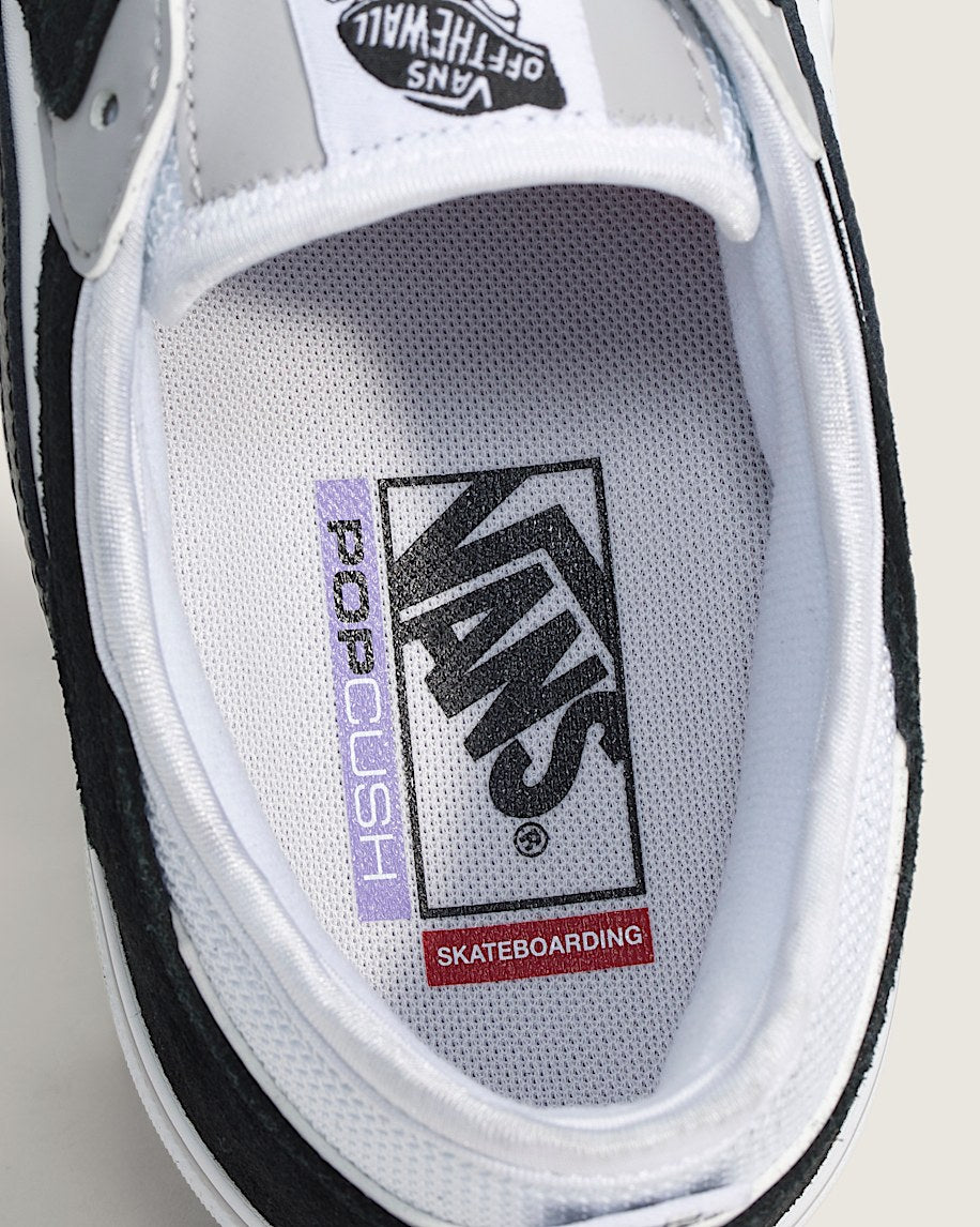Close-up of a Vans sneaker with visible branding on the white insole.