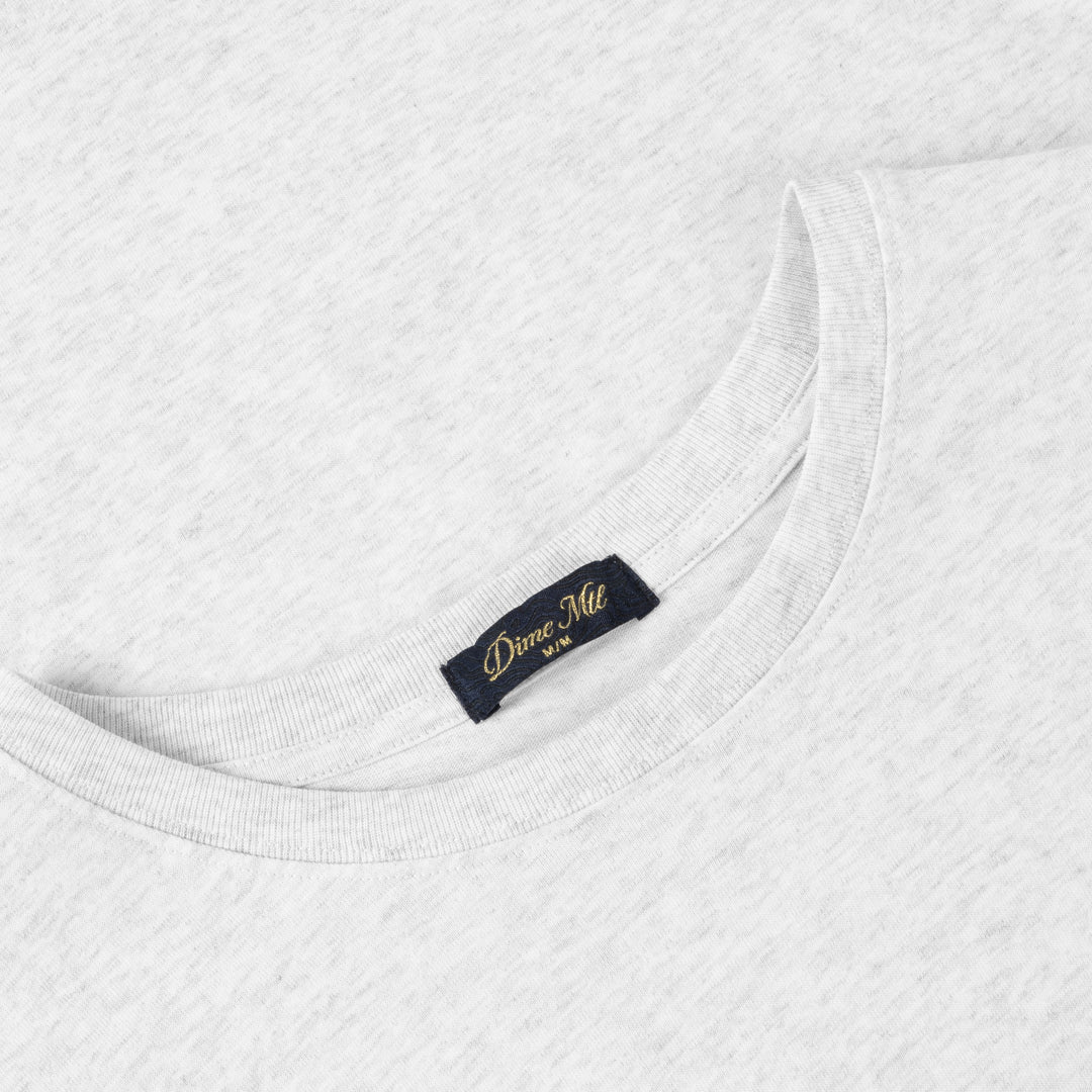 Close-up of a white shirt with a label on a white background