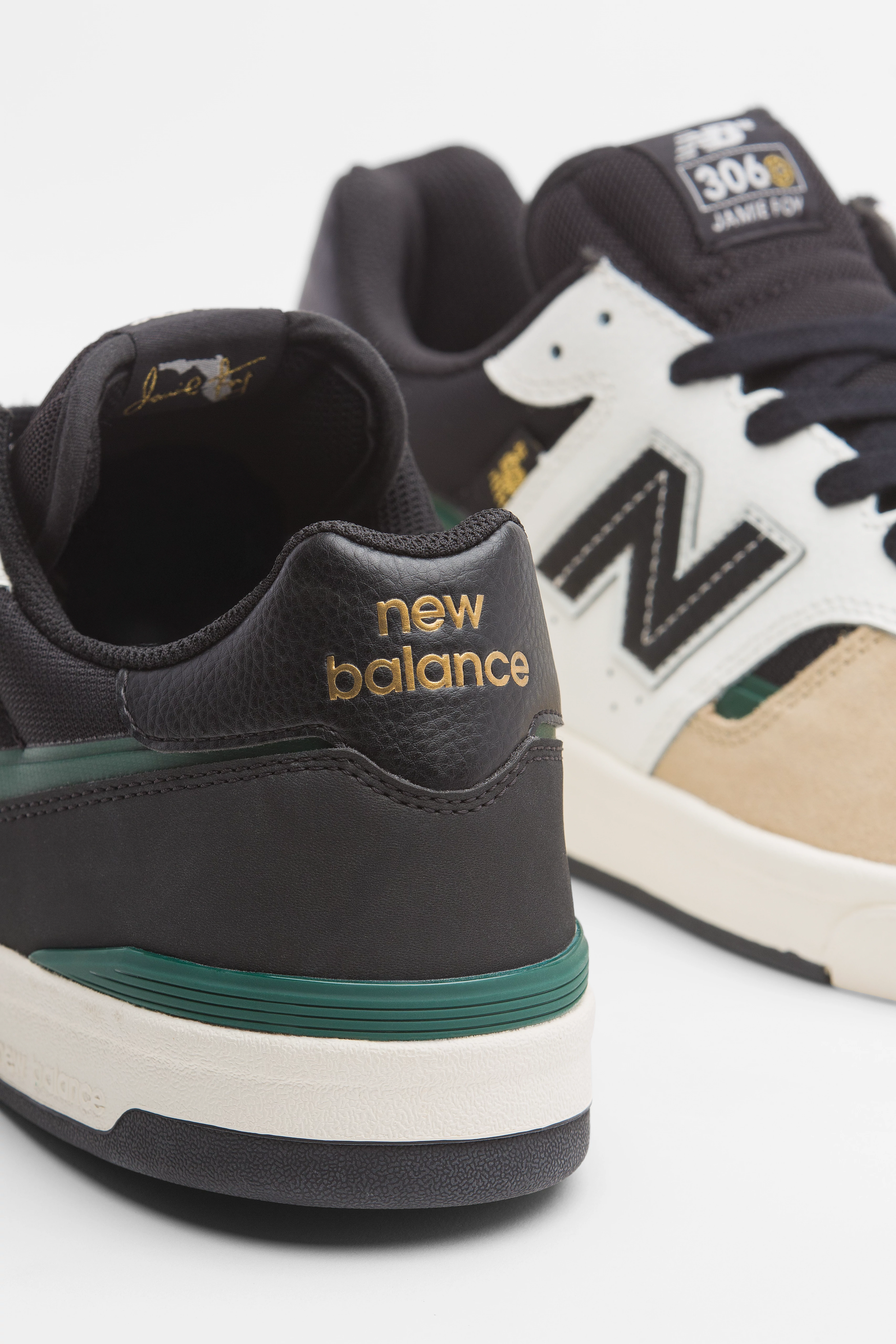Close-up of New Balance sneakers with a focus on the brand logo.