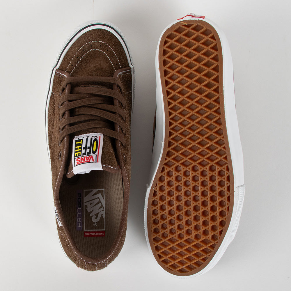 A pair of brown suede Vans Off-White sneakers shown from the top and side, displaying the brown waffle-patterned sole and white rubber trim on a light gray background.