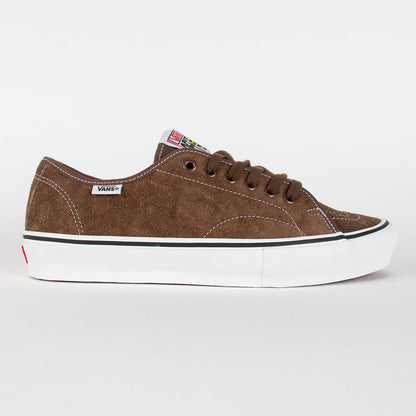A brown suede Vans platform sneaker with a white rubber sole, black stripe, and white Vans side tag, shown in a side profile on a light gray background.