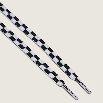 Black and white checkered shoelaces on a light gray background