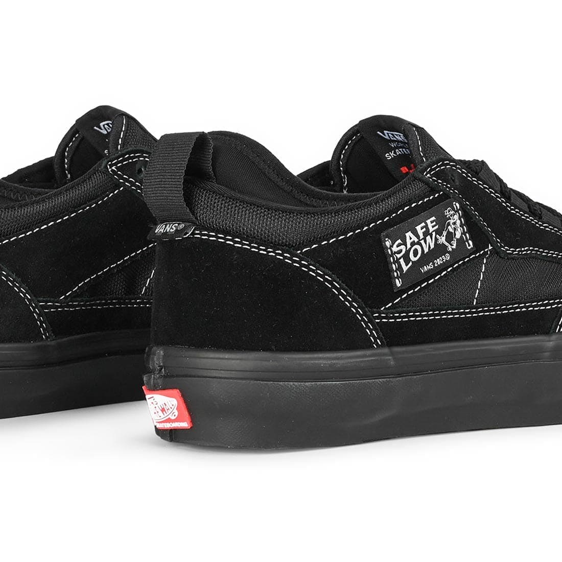 Black sneakers with visible brand logos on a white background