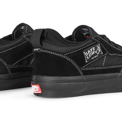 Black sneakers with visible brand logos on a white background