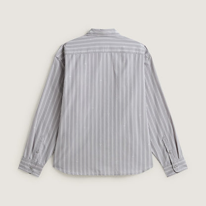 A long-sleeve button-up shirt with vertical gray and white stripes, shown from the back on a light beige background.