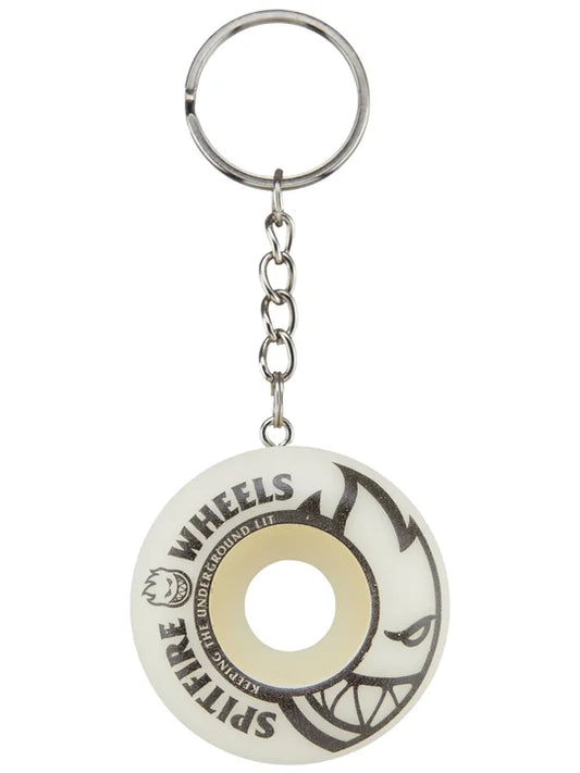 Keychain shaped like a skateboard wheel with 'Spitfire Wheels' branding on a white background