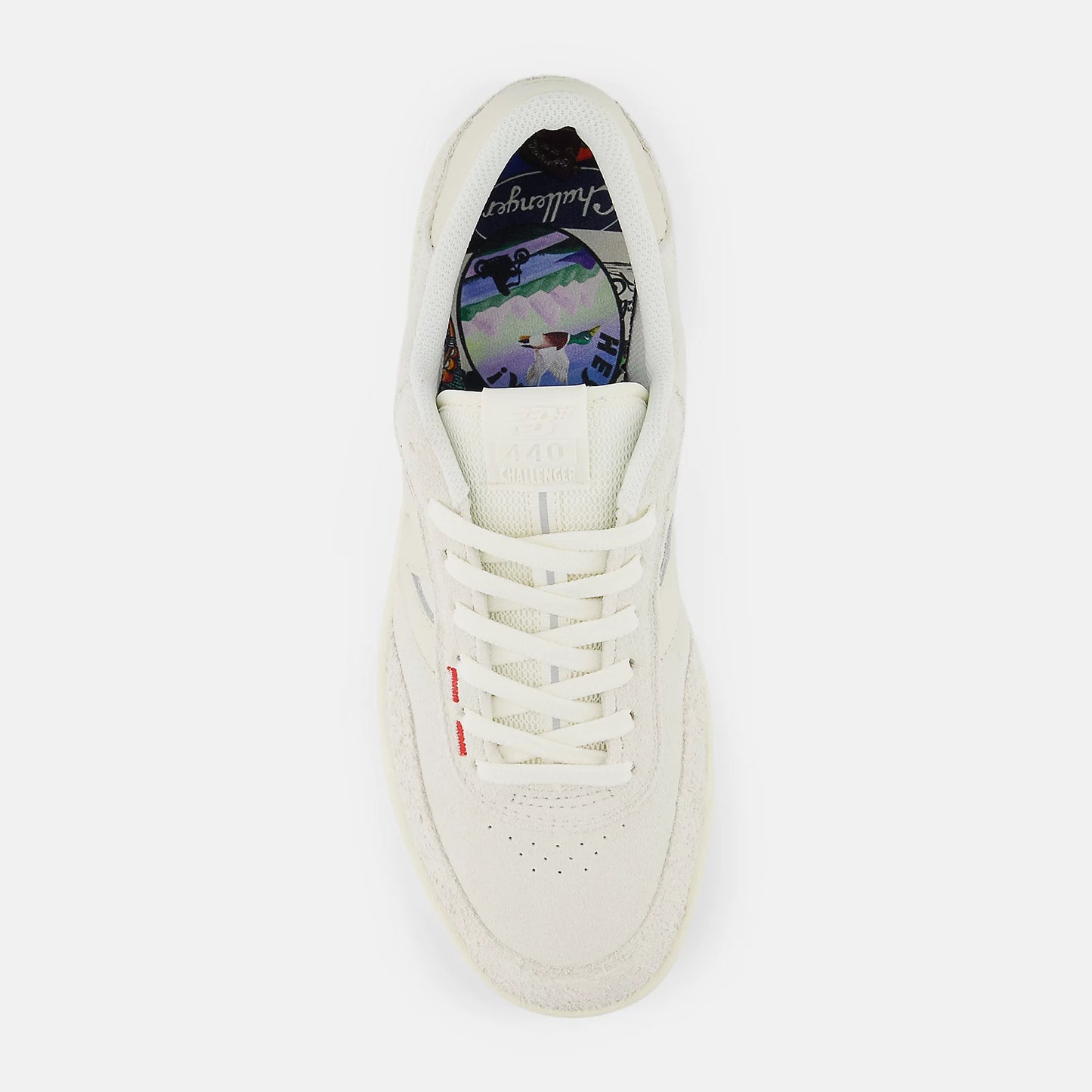 White sneaker with colorful sole on a white background