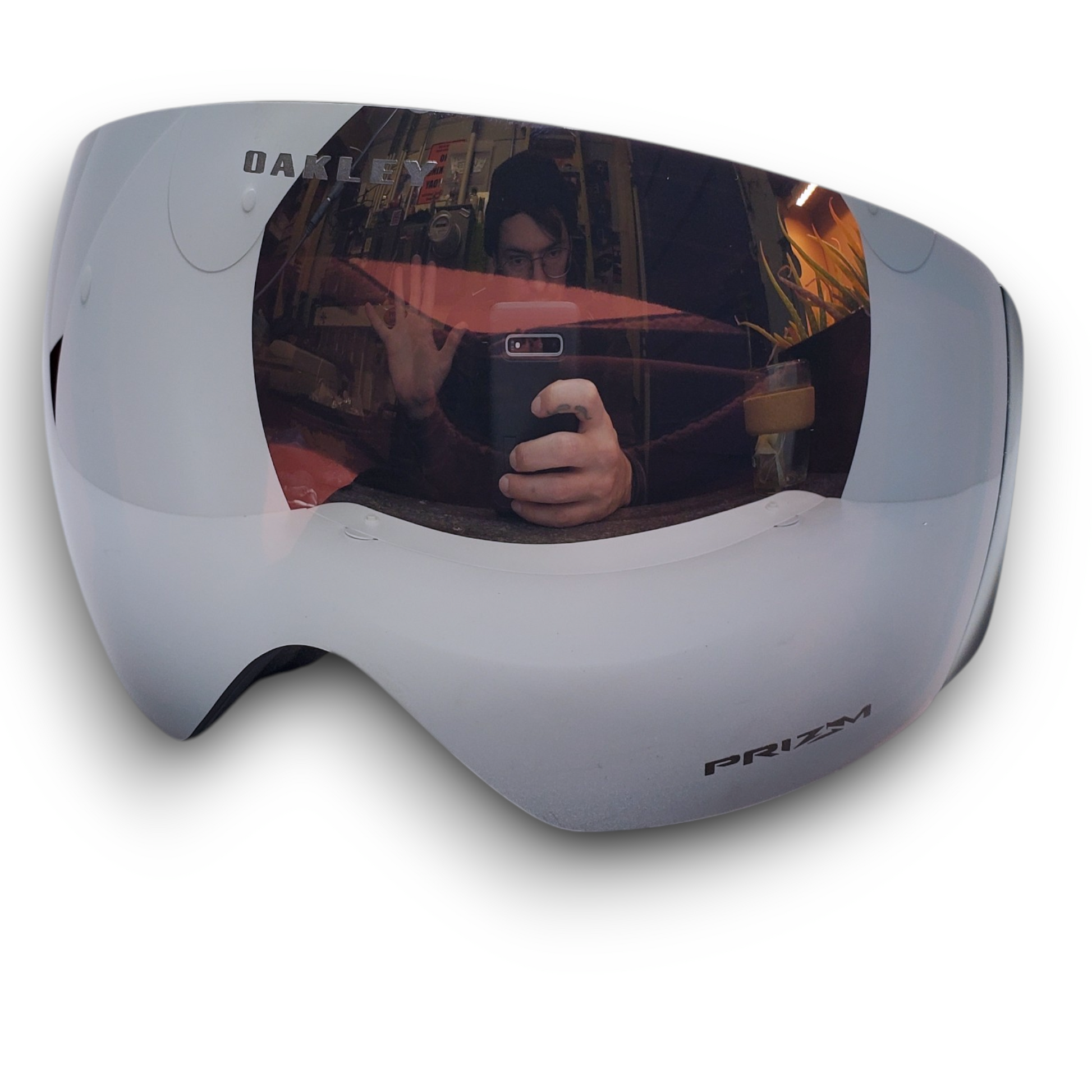 White goggles with reflective lens on a white background