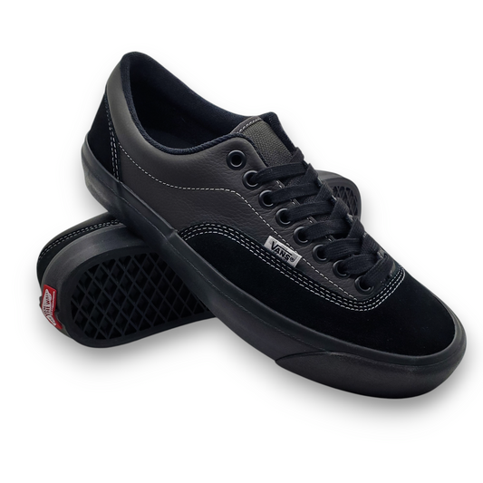 Black Vans sneaker on a white background