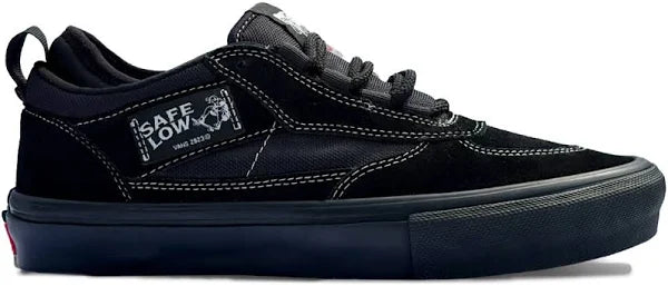 Black sneaker with visible branding on a white background