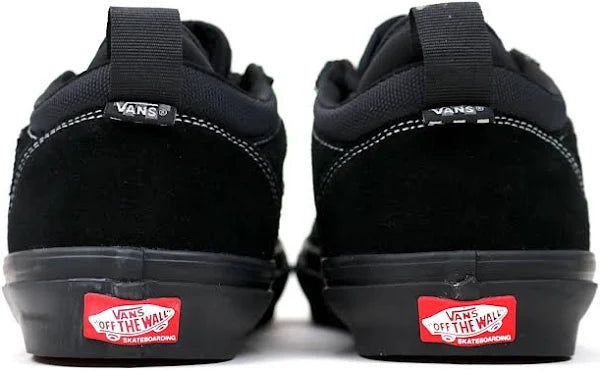 Black Vans shoes with red 'Off The Wall' logo on a white background