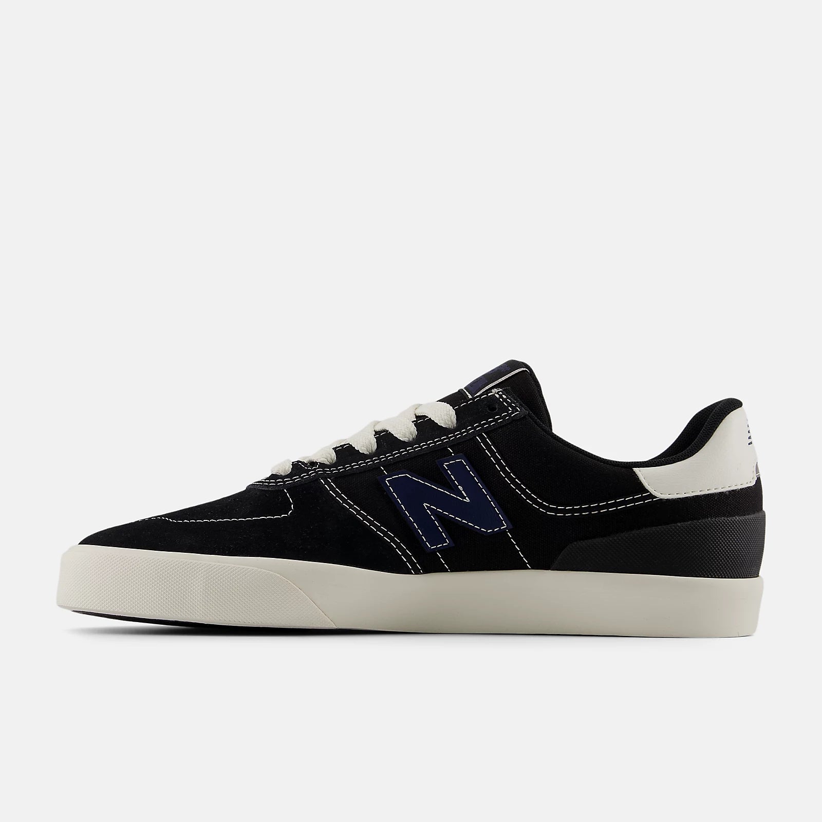 Black and white sneaker with a prominent 'N' logo on a light gray background