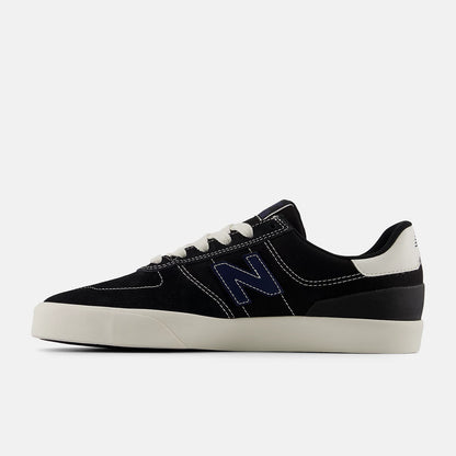 Black and white sneaker with a prominent 'N' logo on a light gray background